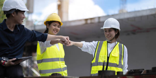 Team job of teamwork engineer work together in a construction site with business concept.